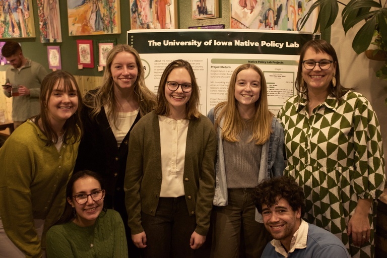 Photo of Native Policy Lab Researchers in front of a research poster